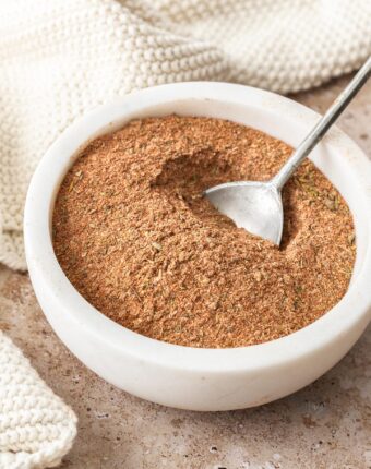 Cajun seasoning in a bowl with a spoon.