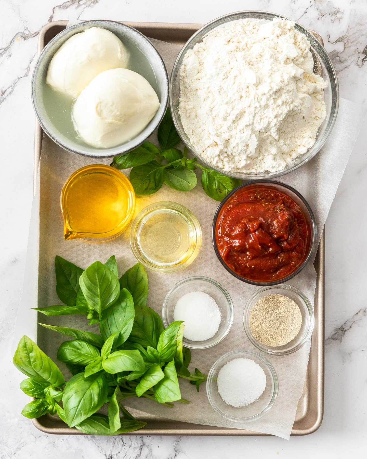 Ingredients for pizza fritta on a baking tray.