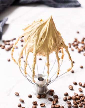 Coffee buttercream on a balloon whisk.
