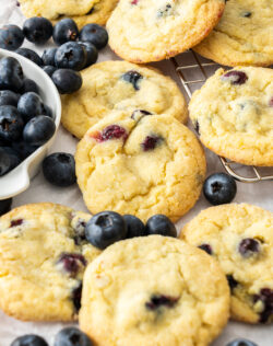 Closeup of the baked cookies with blueberries around.