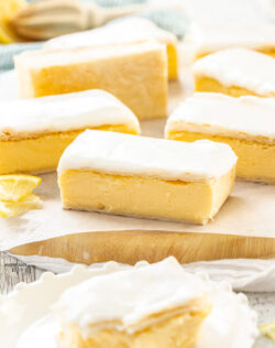 7 pieces of custard slice on a wooden board.