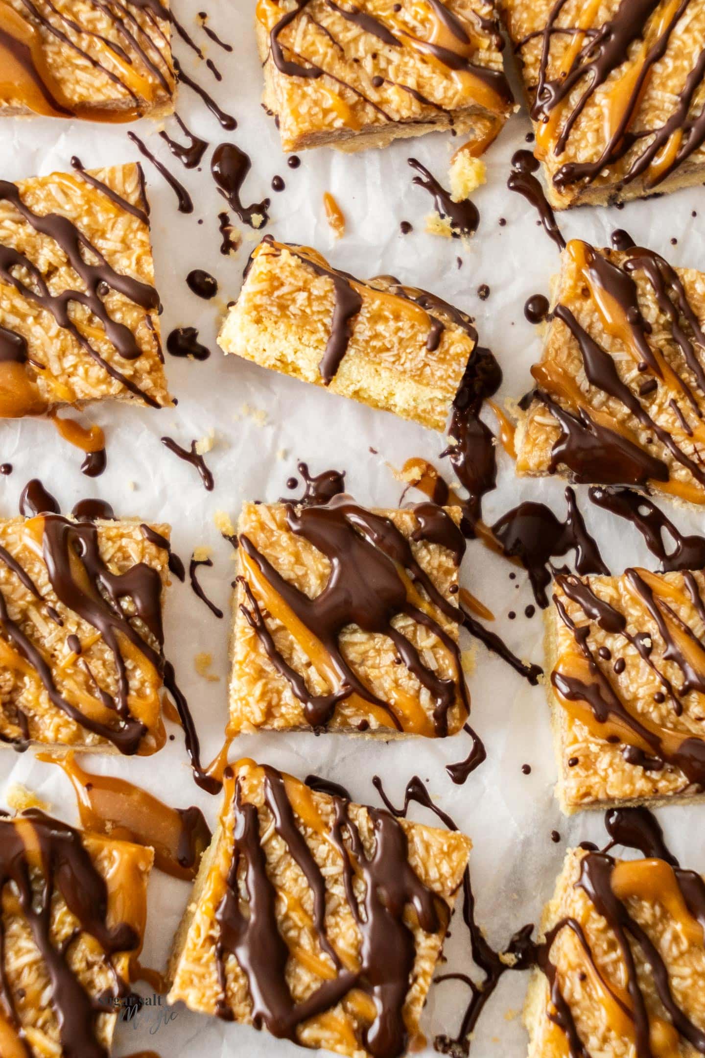 12 coconut caramel bars drizzled with chocolate.