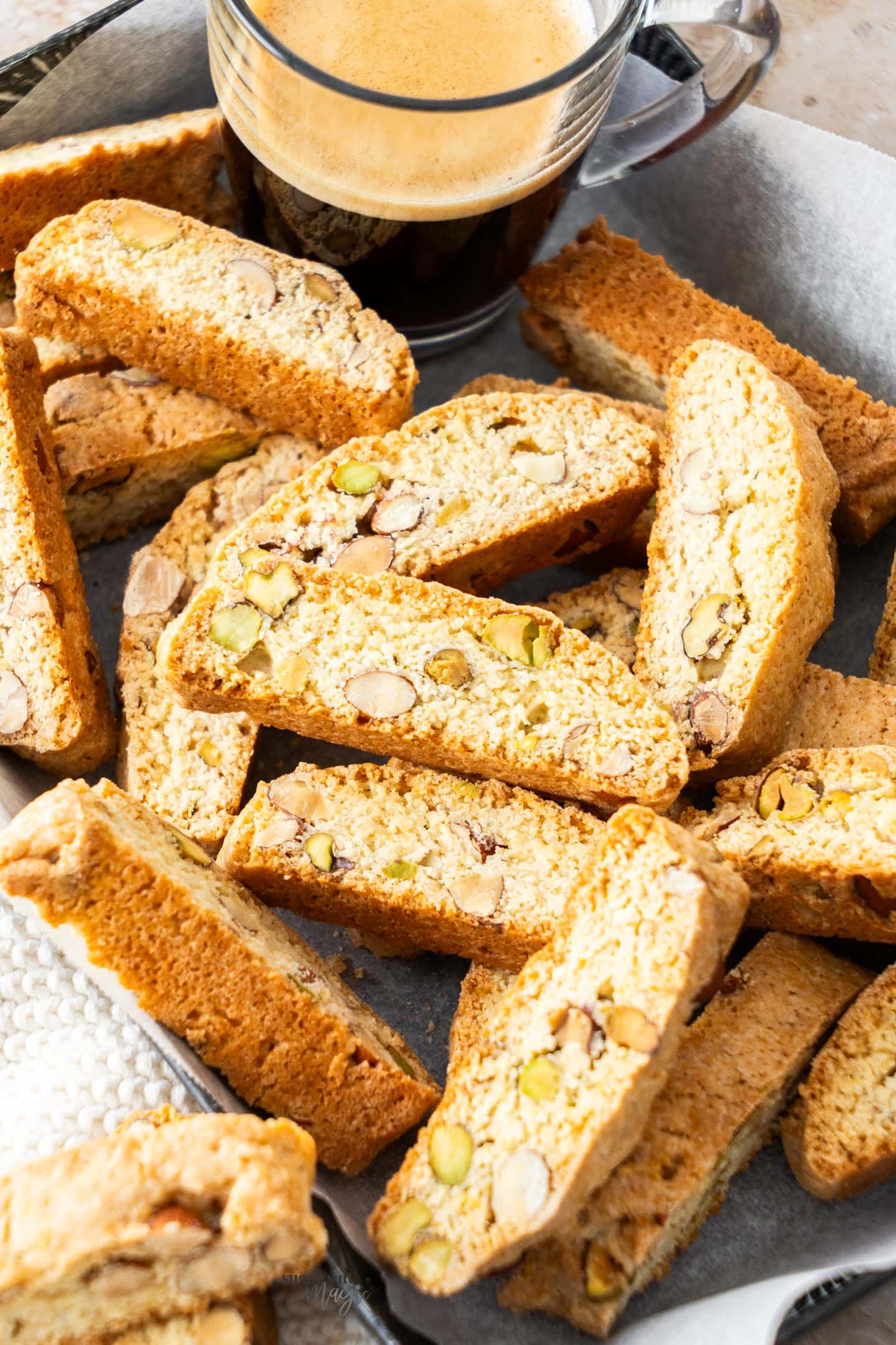 A pile of lemon biscotti in a tray.