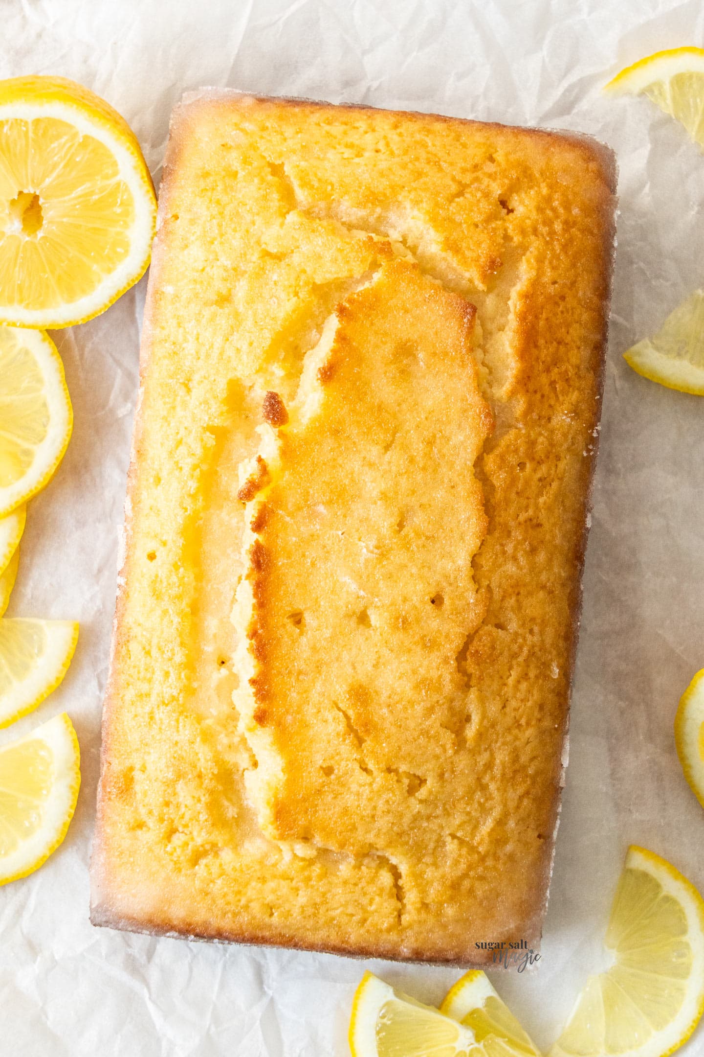 Top down view of a whole lemon loaf cake.