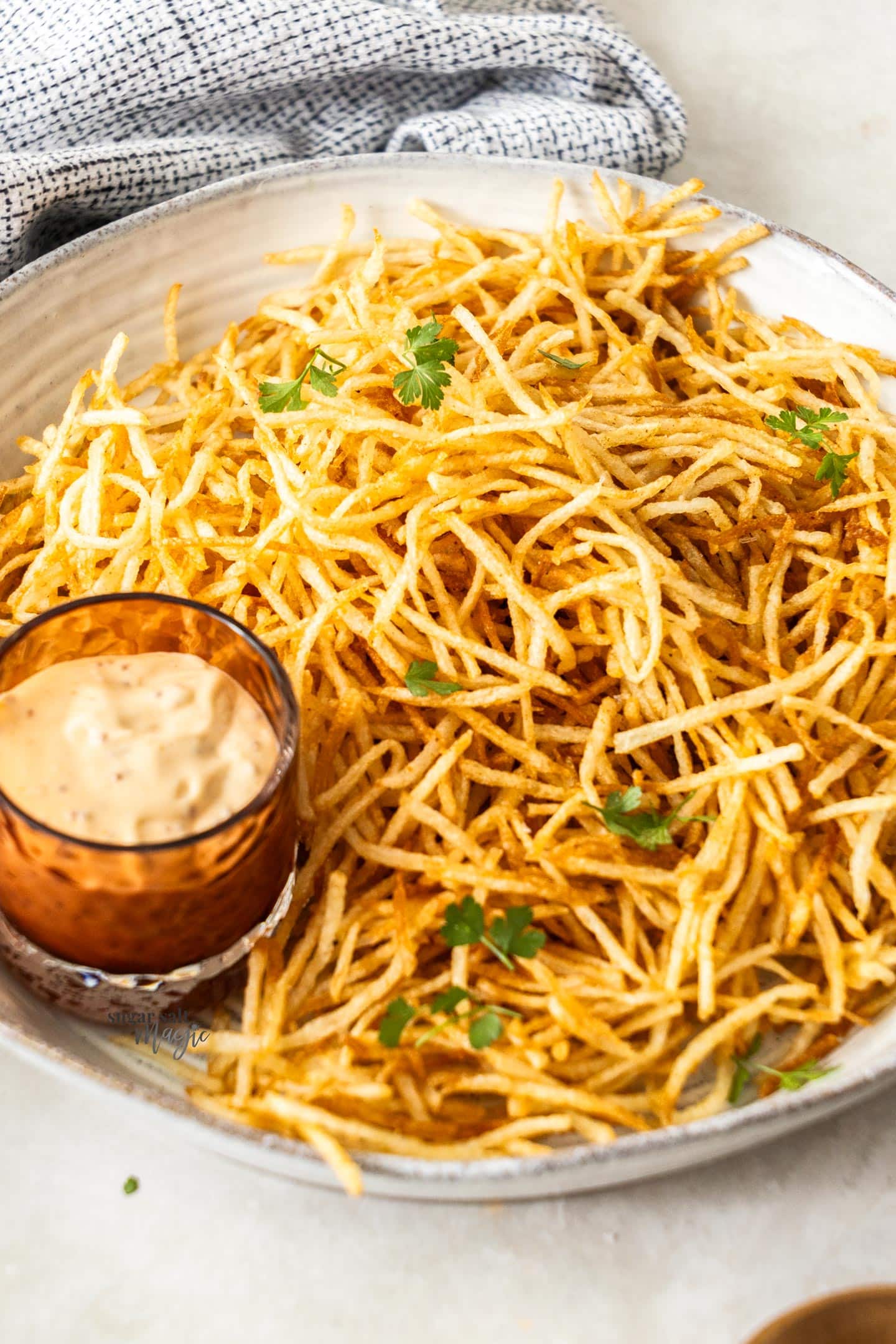 A bowl of shoestring fries.