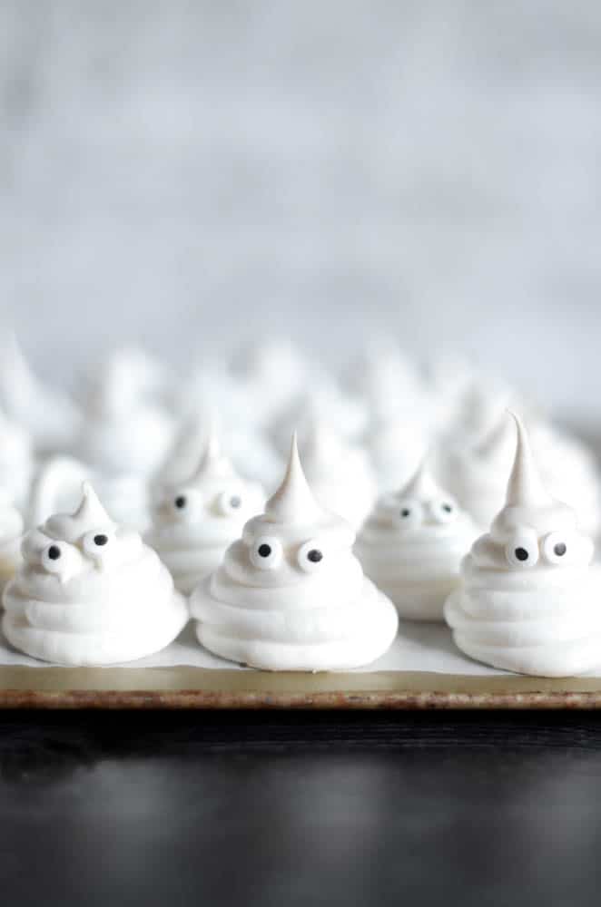 Meringue ghosts with candy eyesl