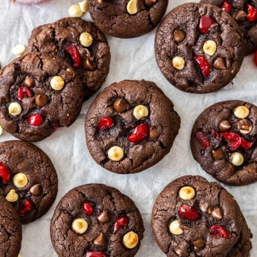 A batch of black forest cookies on a sheet of baking paper.