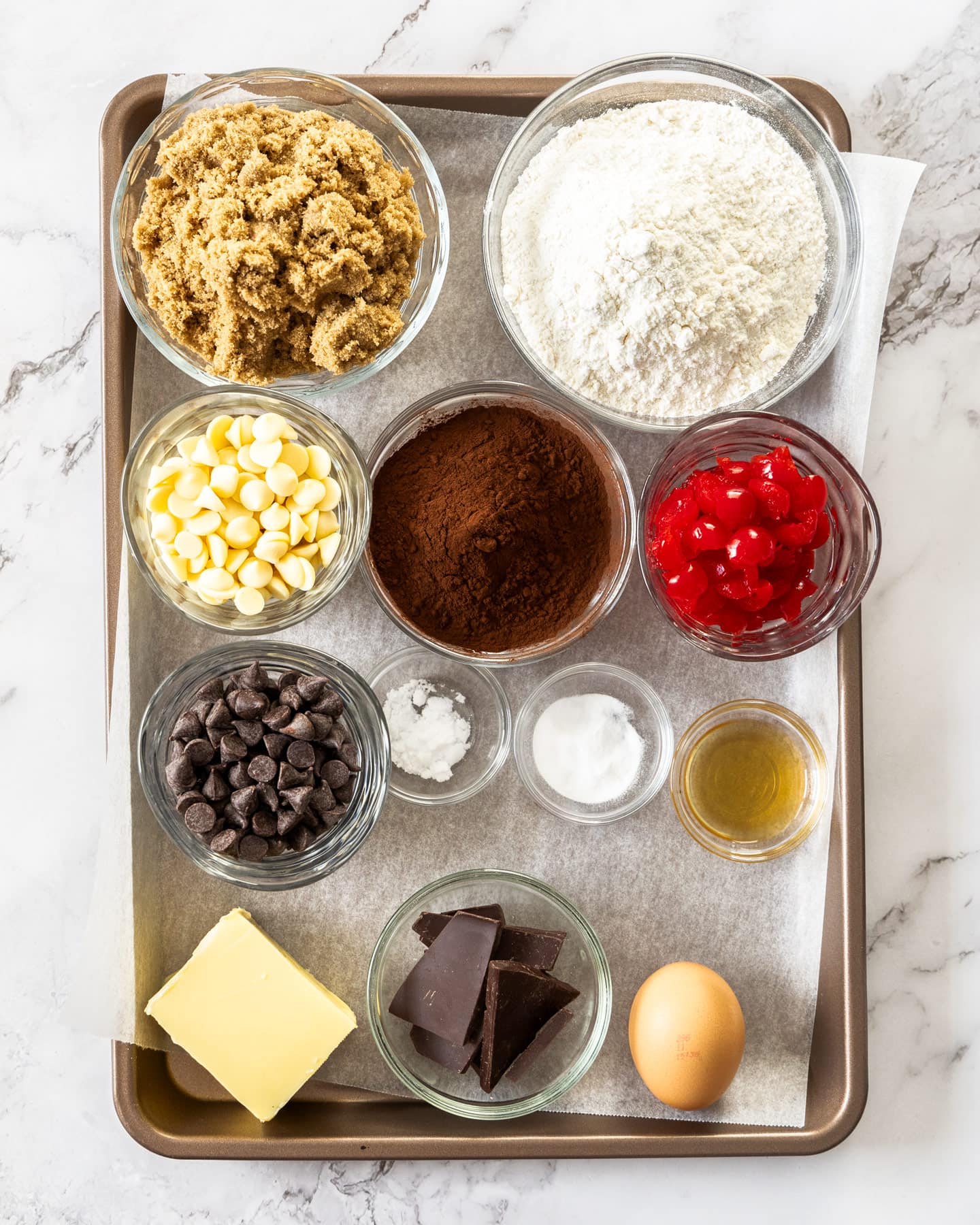 Ingredients for black forest cookies on a baking tray.