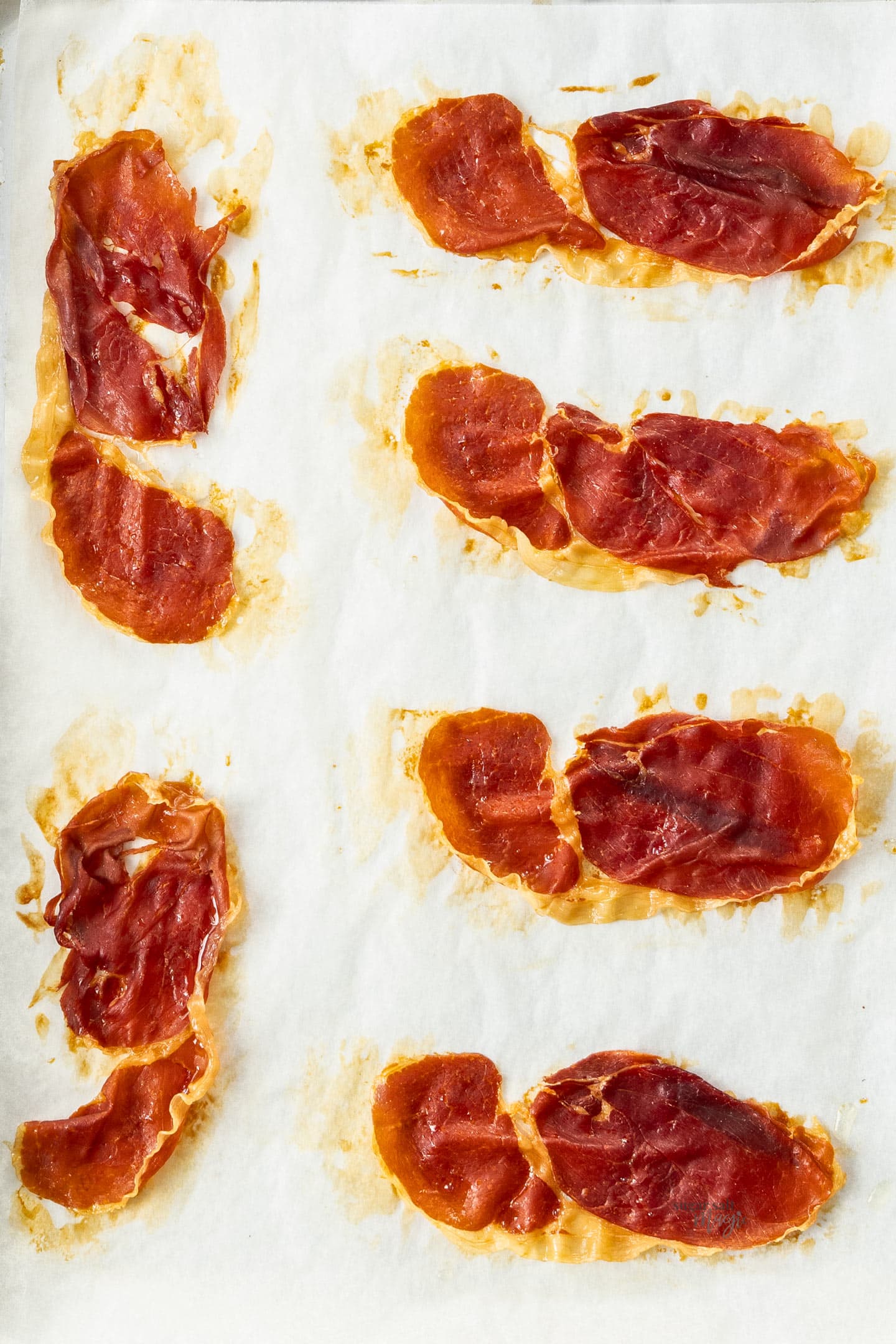 A baking tray topped with crispy prosciutto.