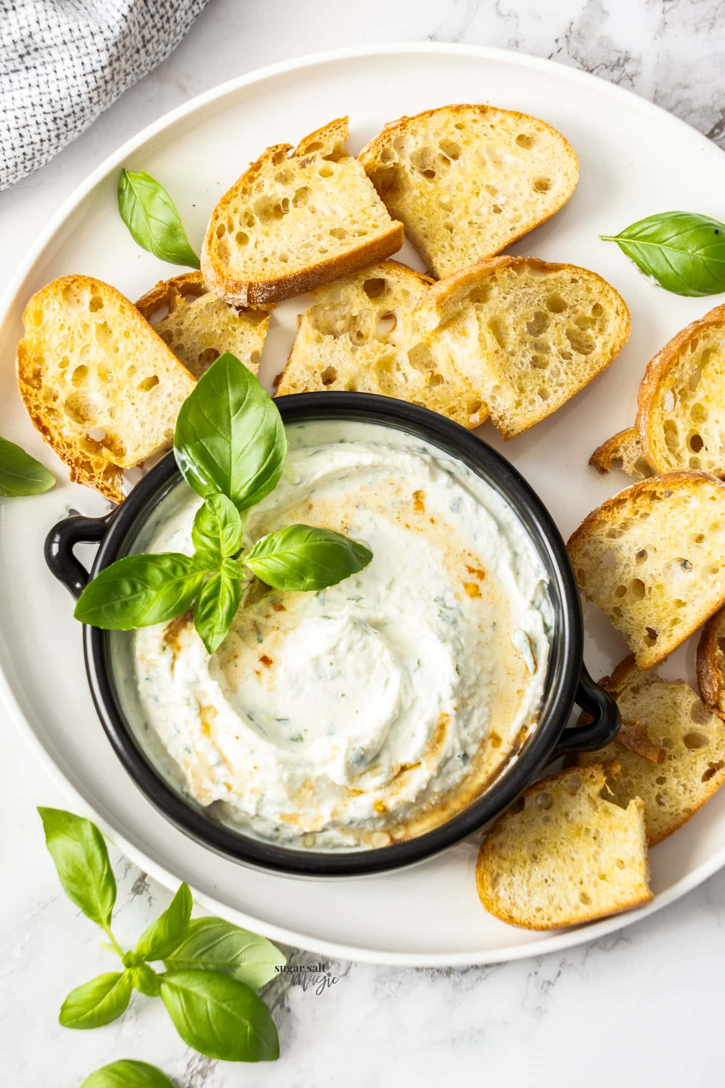 Top down view of ricotta dip in a bowl.