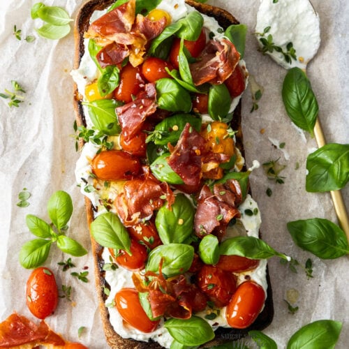 Top down view of a whole roasted tomato bruschetta.