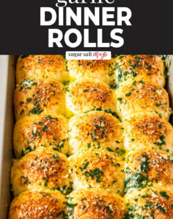 A batch of 15 dinner rolls in a baking pan.
