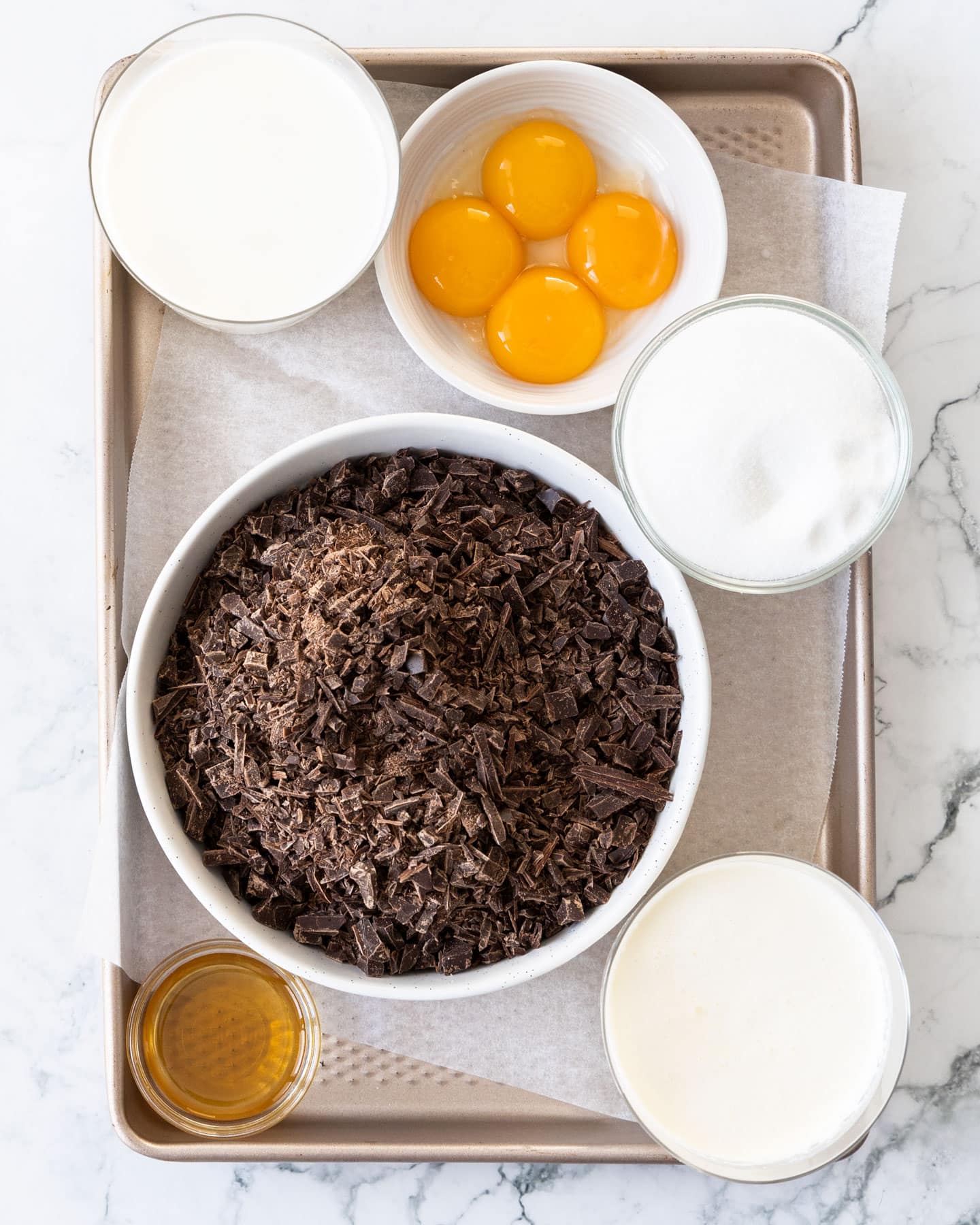 Ingredients for chocolate cremeux on a baking tray.