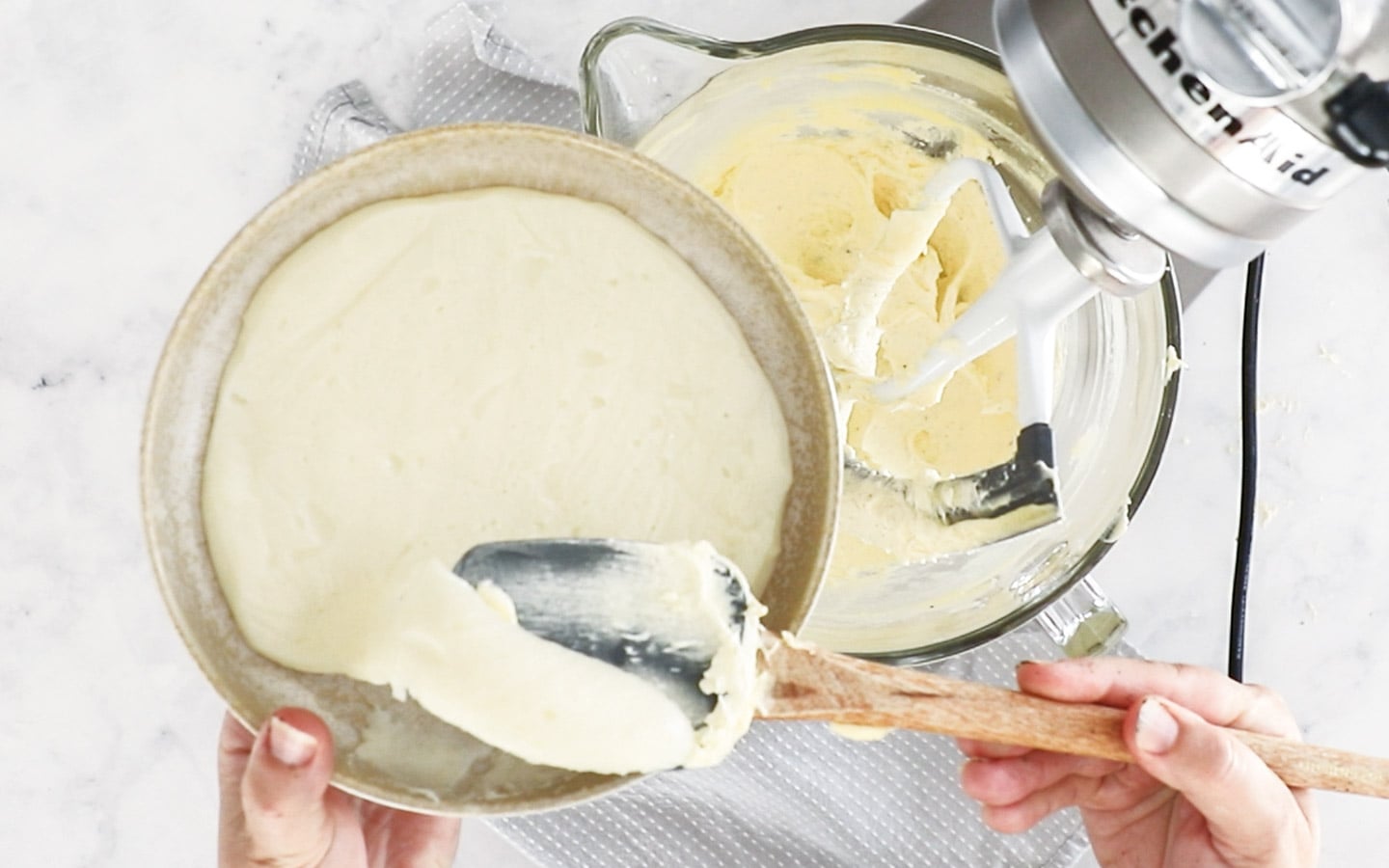 Adding flour and milk pudding to butter in a mixer.