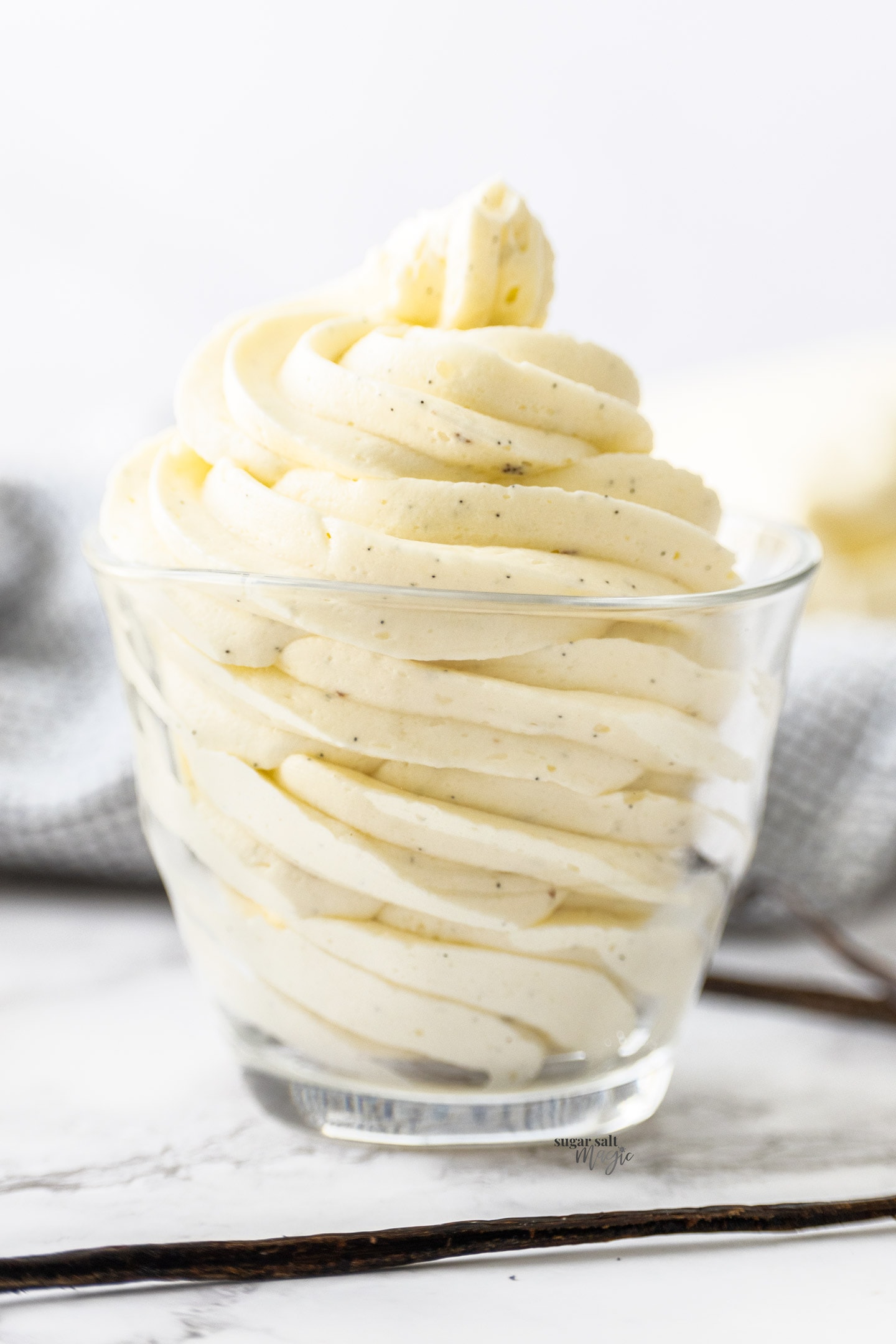 Vanilla bean frosted piped in swirls into a glass.