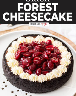 A whole black forest cheesecake on a platter.