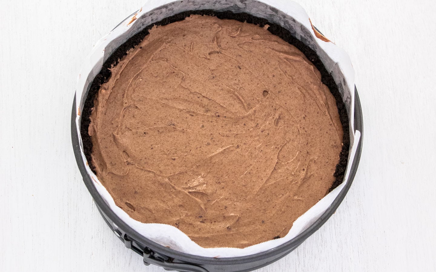 The chocolate cheesecake batter in the pan.