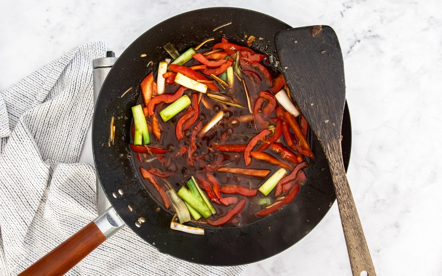 The sauce added to the vegetables in the wok.