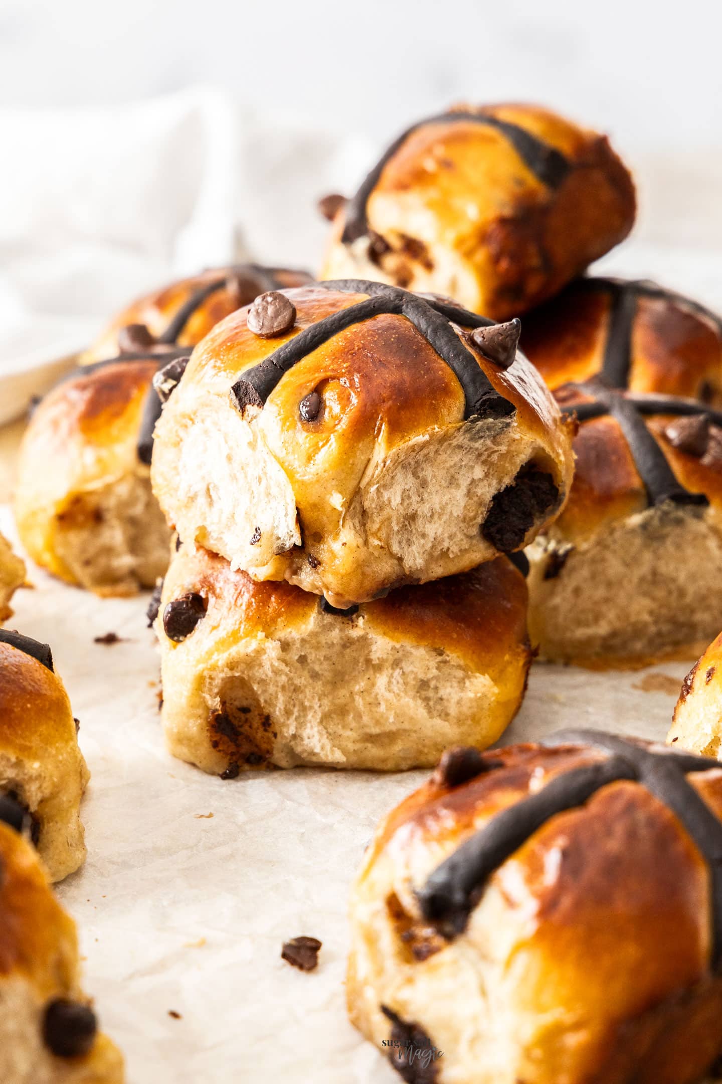 Two hot cross buns stacked.