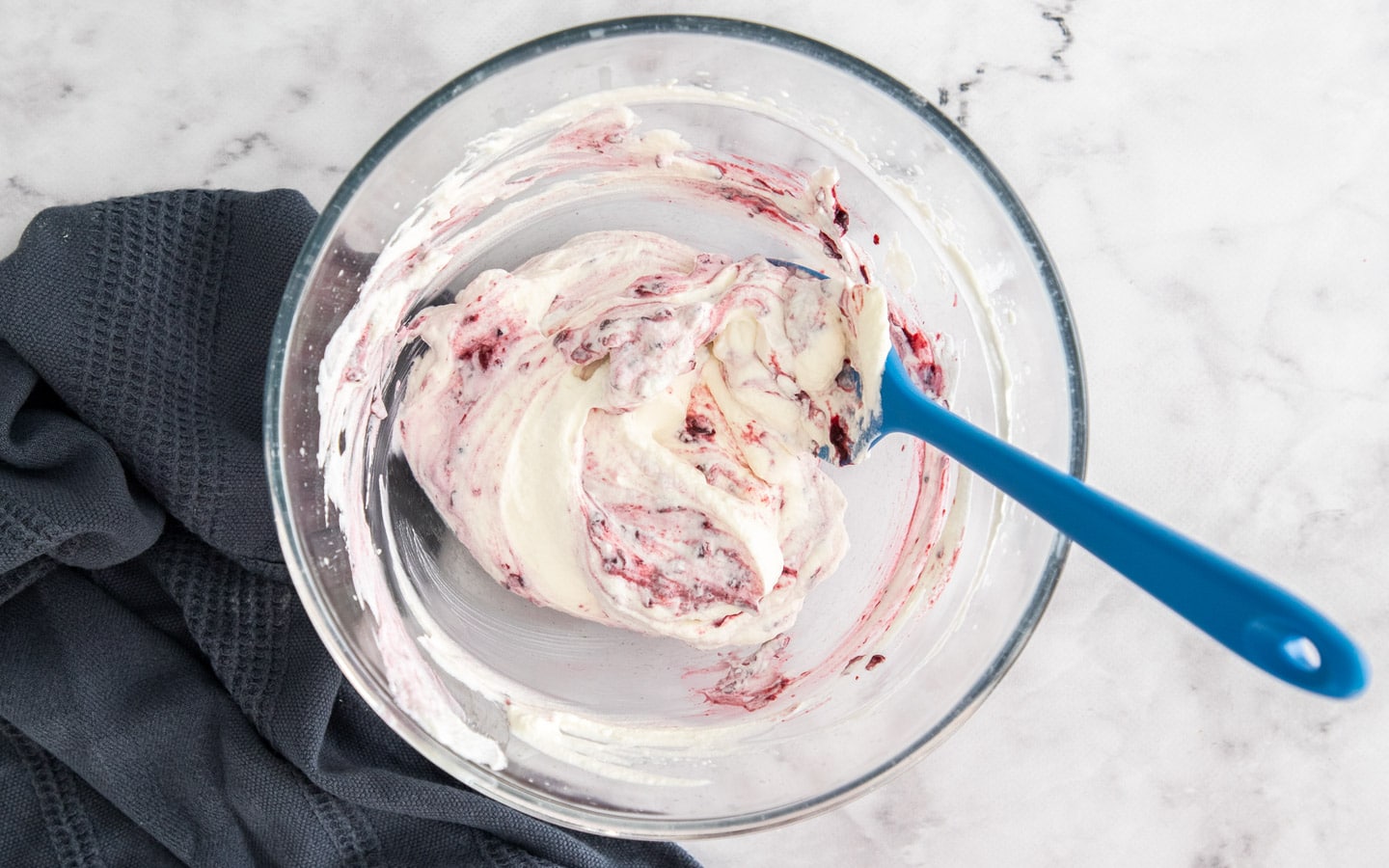 Swirling the compote through whipped cream.