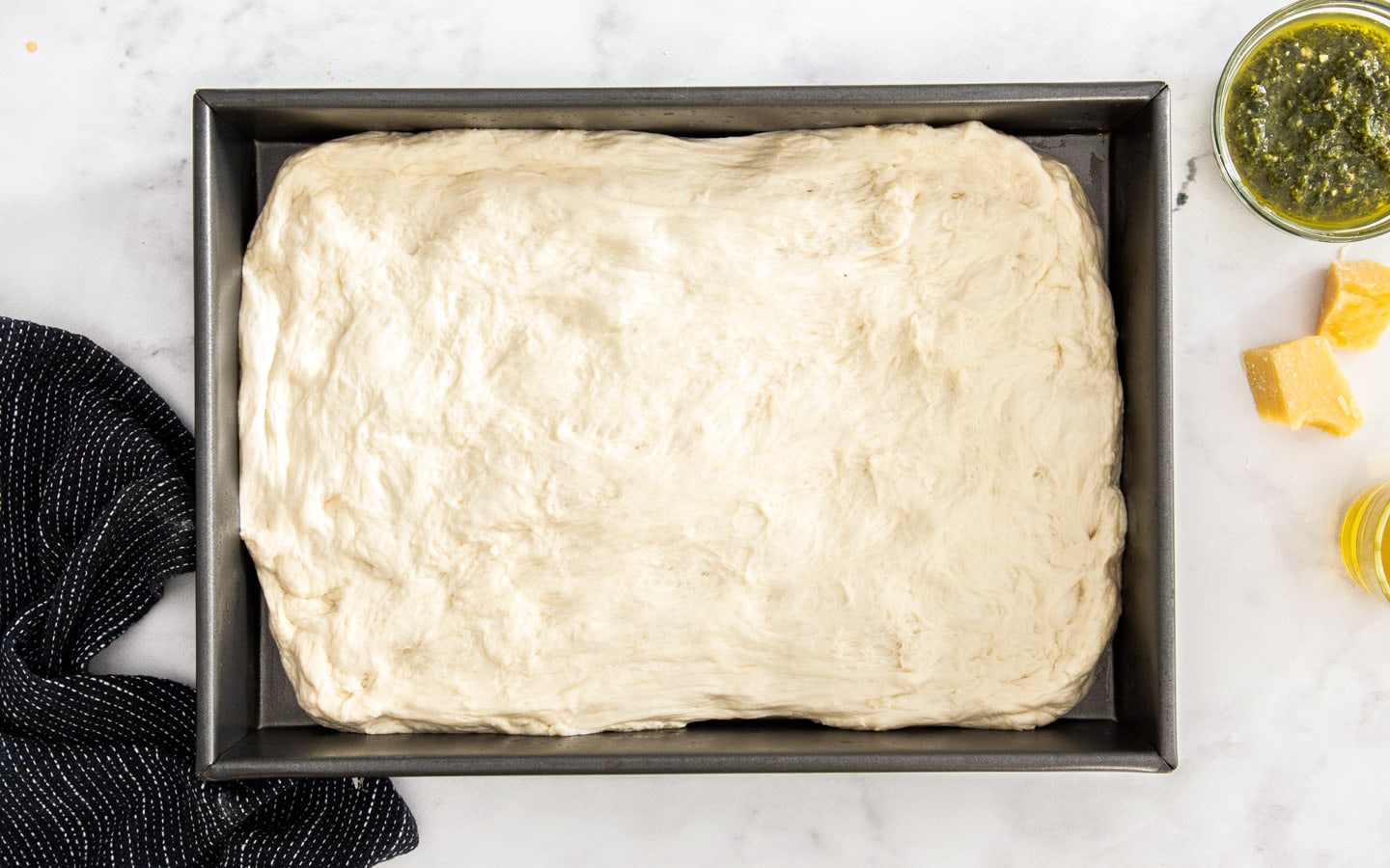 The dough spread out in a 9x13 inch pan.
