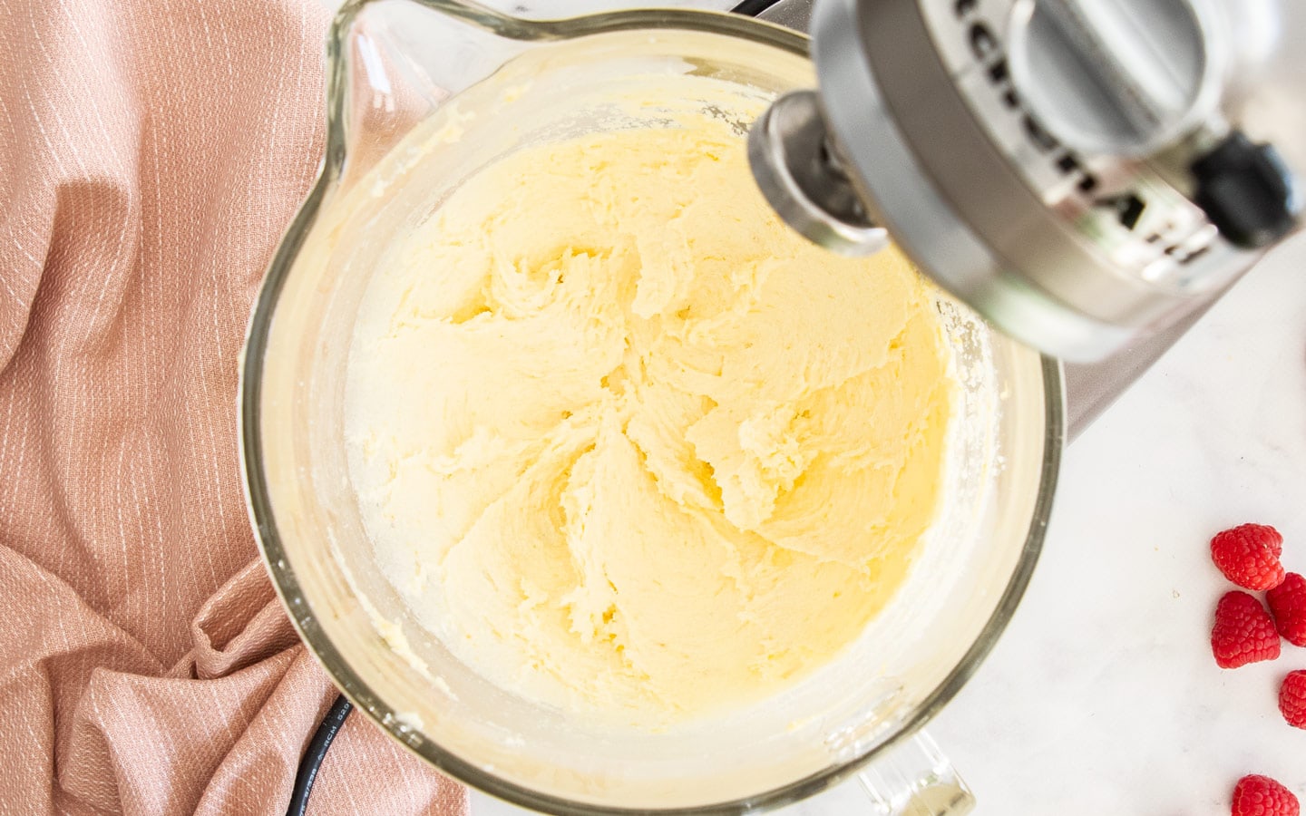 The creamed butter and sugar in the bowl of as stand mixer.