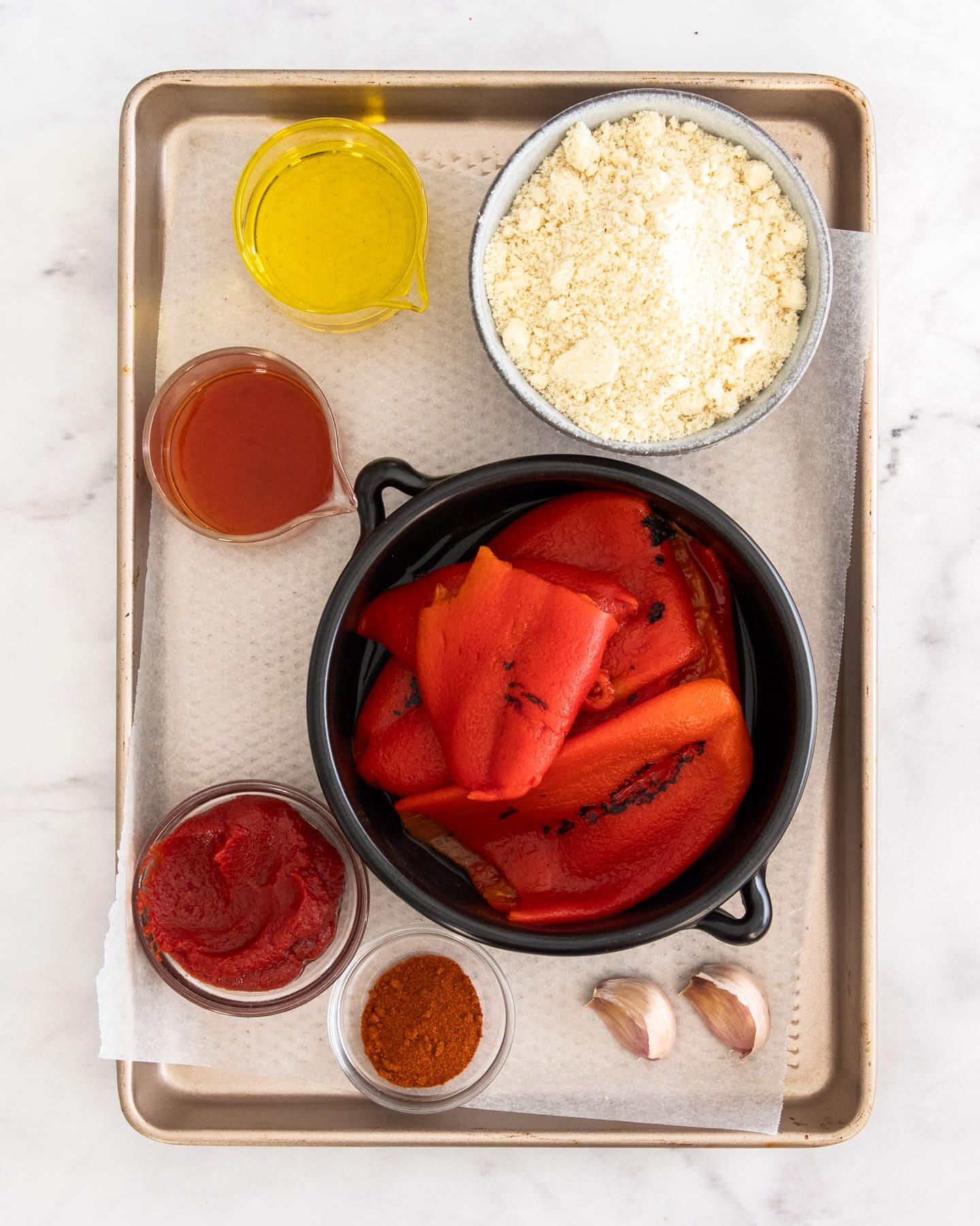 Ingredients for romesco sauce on a baking tray.
