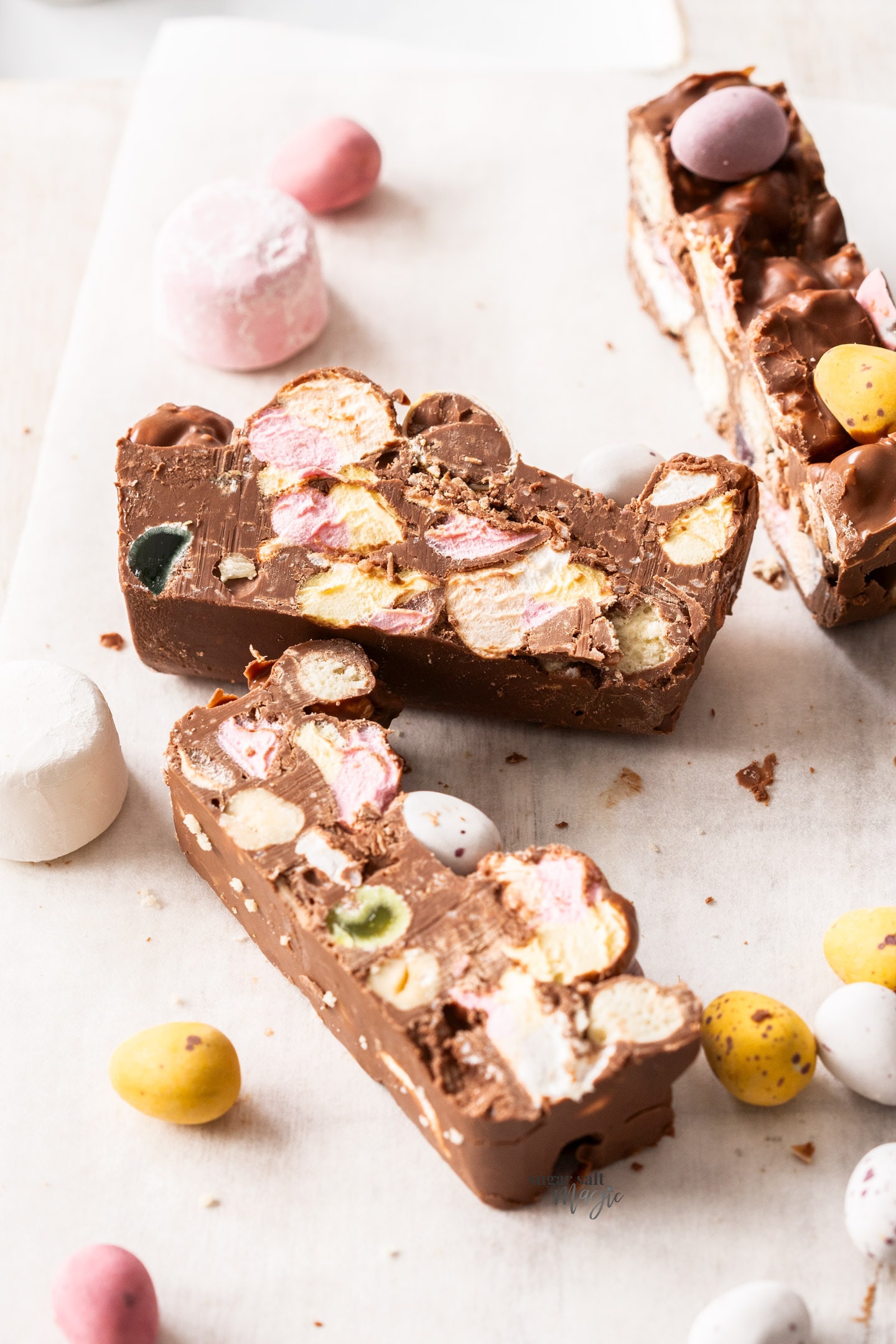 3 slices of rocky road with easter eggs in it.