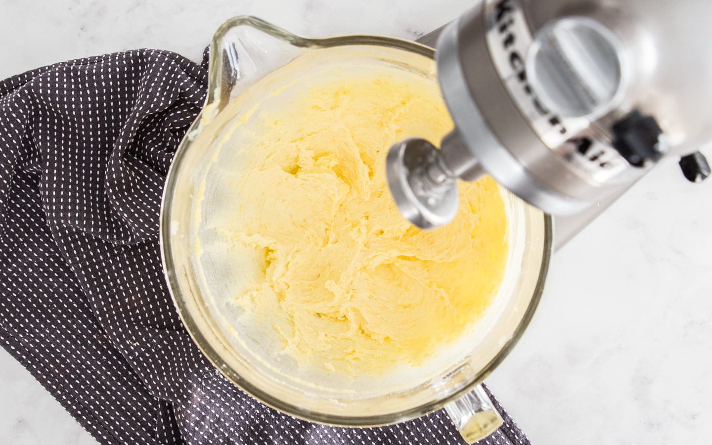 The butter and sugar creamed together in a stand mixer bowl.