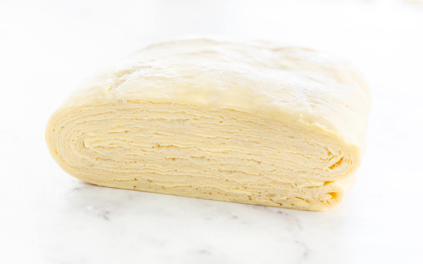 Closeup of the side profile of the pastry, showing all the layers.