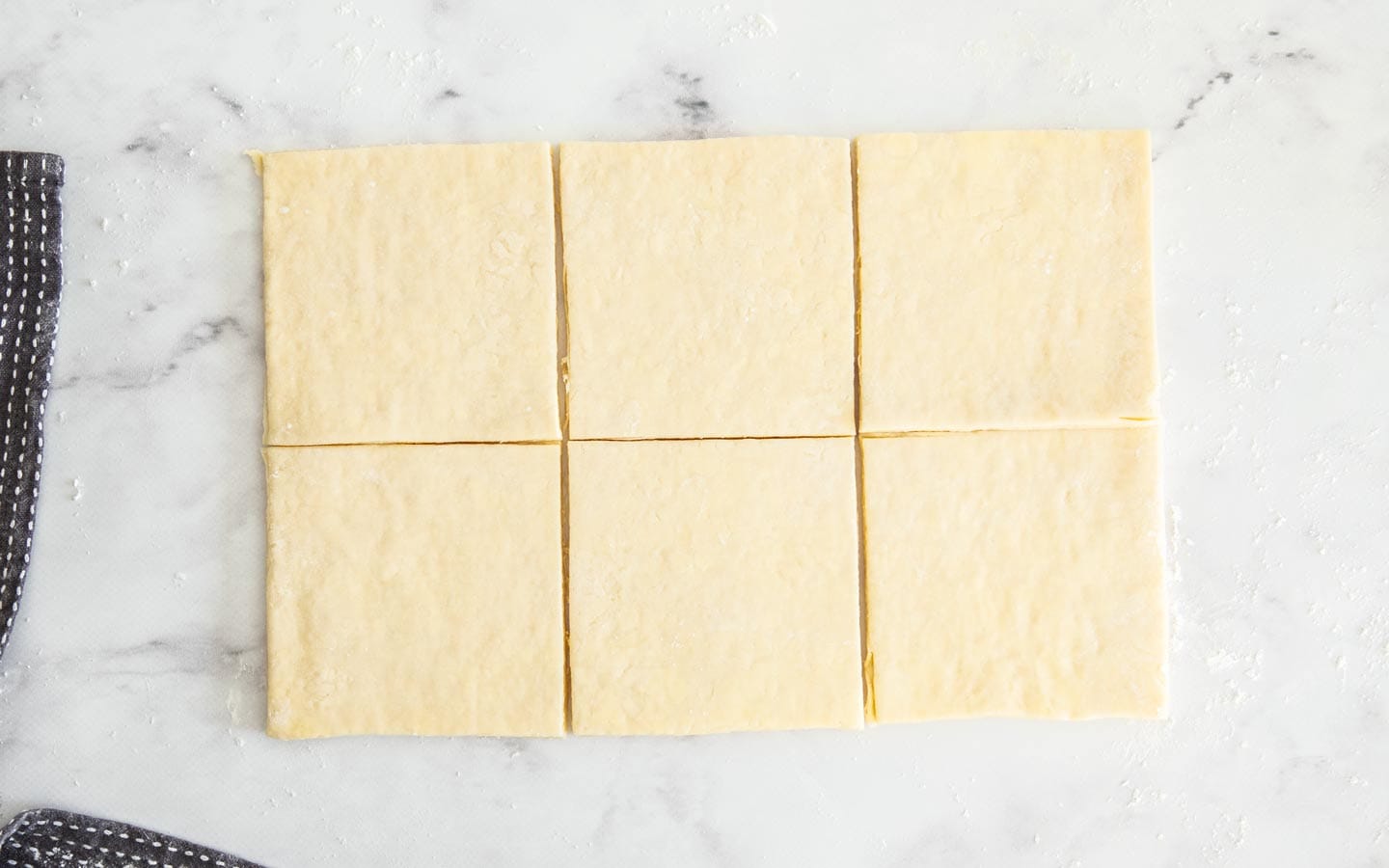 The pastry cut through the middle to make 6 squares.
