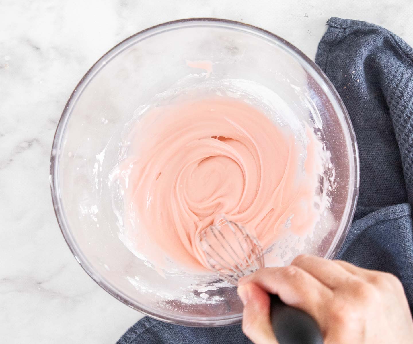 Cherry Chocolate Bundt Cake The cherry icing being whisked in a bowl.