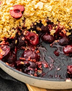 Extreme closeup of cherry crumble.