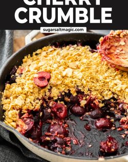 Sticky cherries and a crumble topping in a skillet.