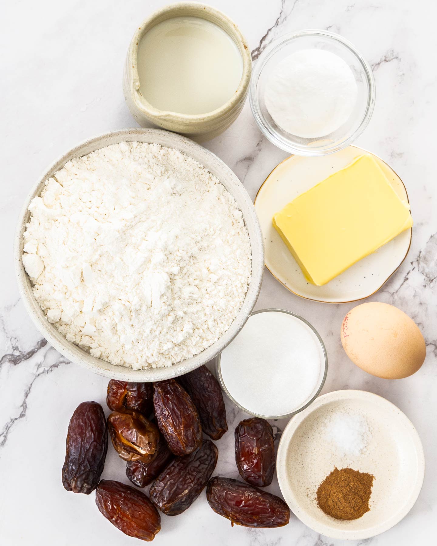 Date Scones Ingredients for date scones on a marble background.