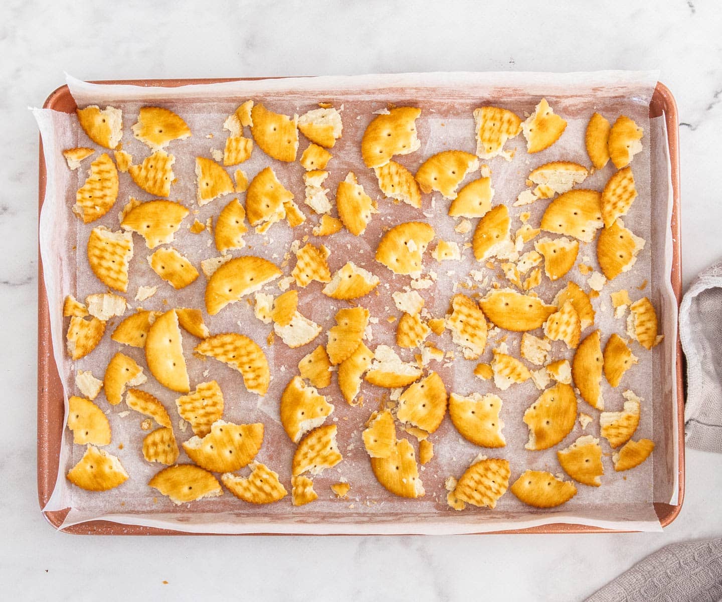 The ritz crackers broken up in the baking tray.