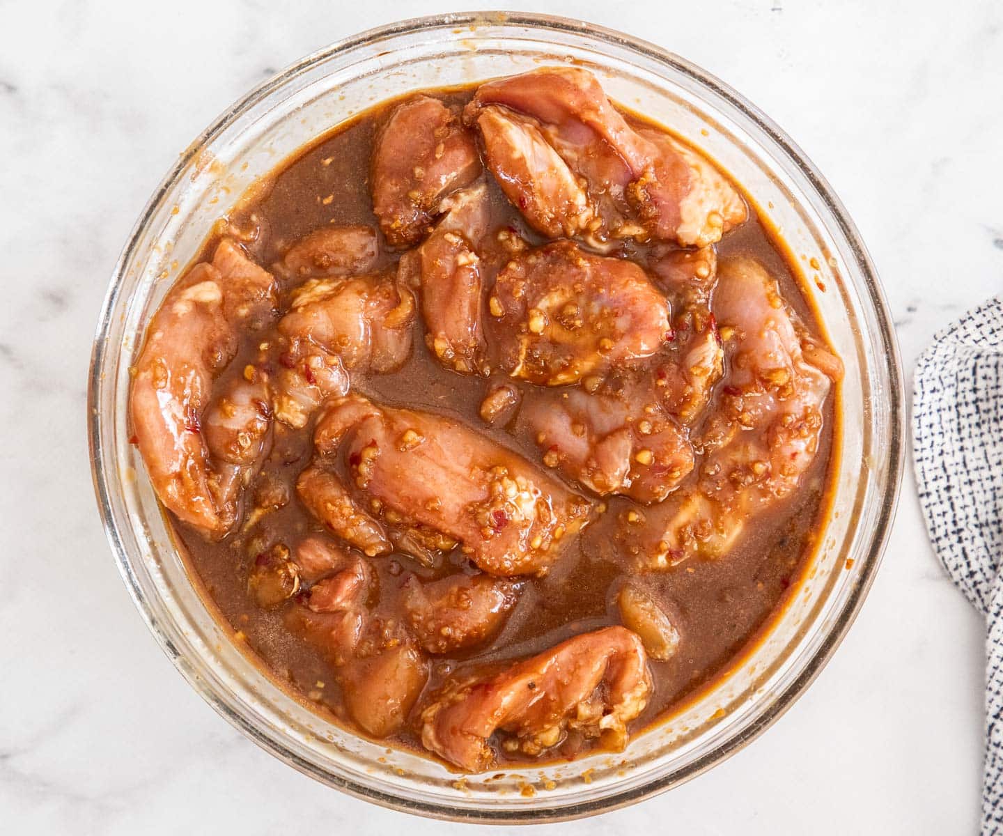 One Pan Baked Chicken and Rice The chicken thighs in the marinade.