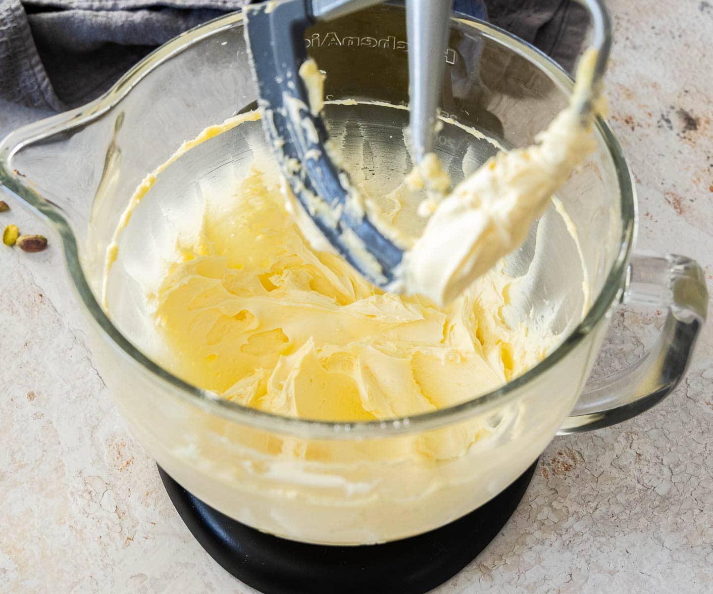 Pistachio Buttercream Butter and sugar beaten until creamy in a mixing bowl.