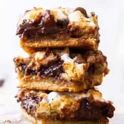 Three s'mores cookie bars stacked.