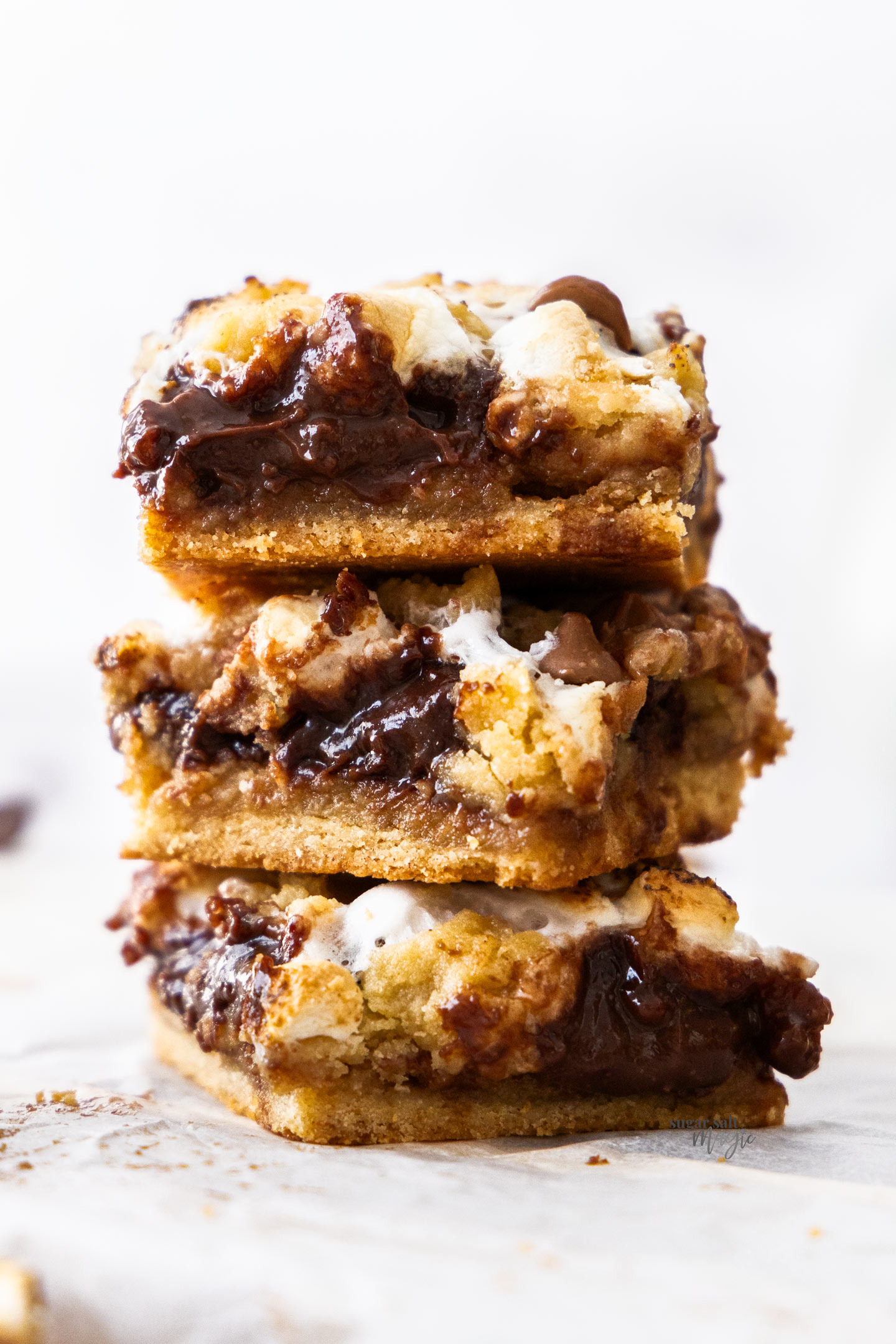 S'mores Cookie Bars Three s'mores cookie bars stacked.