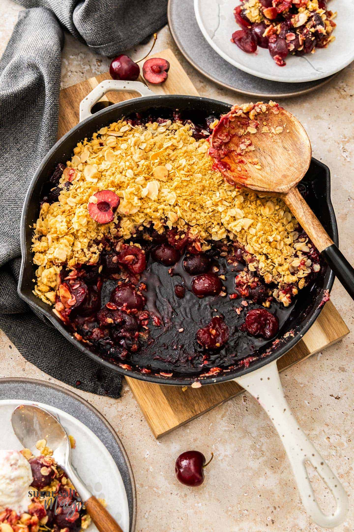 Cherry Crumble Top down view of baked cherry crumble in a skillet.
