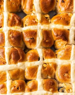 Top down view of 12 hot cross buns.