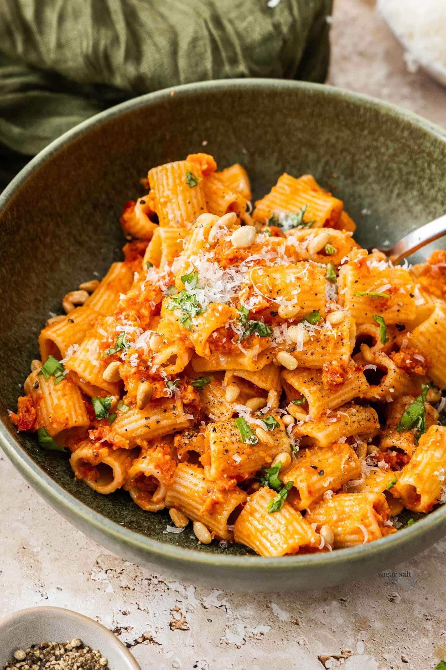 Sun-dried Tomato Pesto Pasta Closeup of a bowl of sundried tomato pesto pasta.