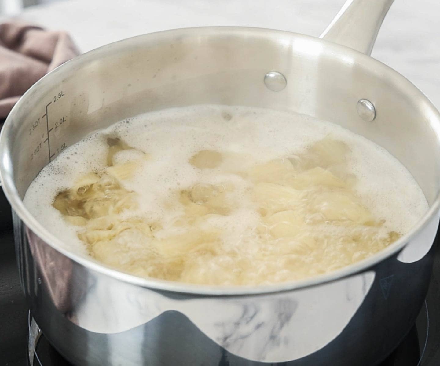 Sun-dried Tomato Pesto Pasta Pasta in a saucepan of boiling water.